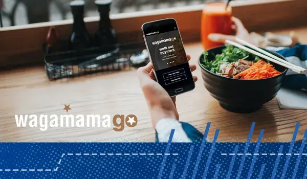 wagamamago application seen on a mobile device held by customer seated in wagamama restaurant