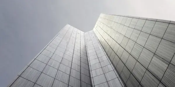 Abstract image of modern commercial building shot against bright sky