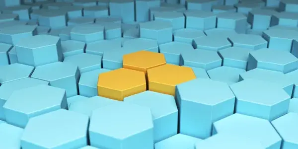 Asbtract image of yellow 3D hexagonal shapes set in sea of blue 3D hexagonal shapes