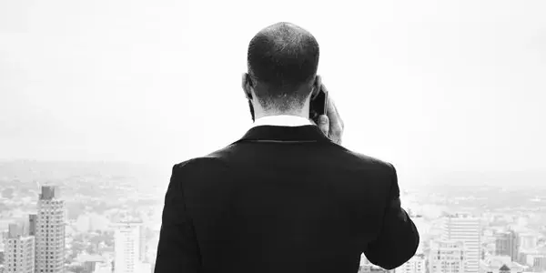 Business person staring out over City